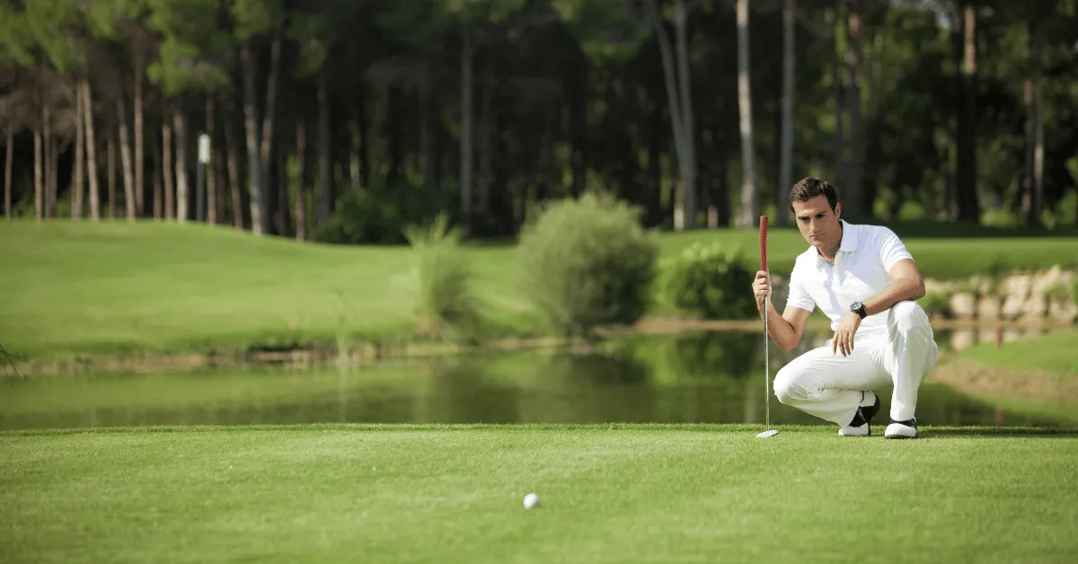 A golfer lines up his eagle putt